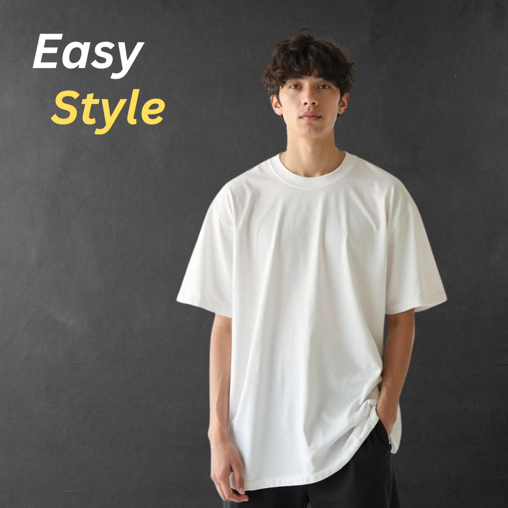 Smart Casual T-Shirt – Premium Comfort & Stylish Everyday Look 9 Smart casual men’s t-shirt in clean white on a model, styled with dark trousers against a textured dark gray background.