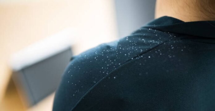 Close-up of sweat-resistant performance fabric showing water droplets on shoulder surface.Sweat Shield Performance Knit: