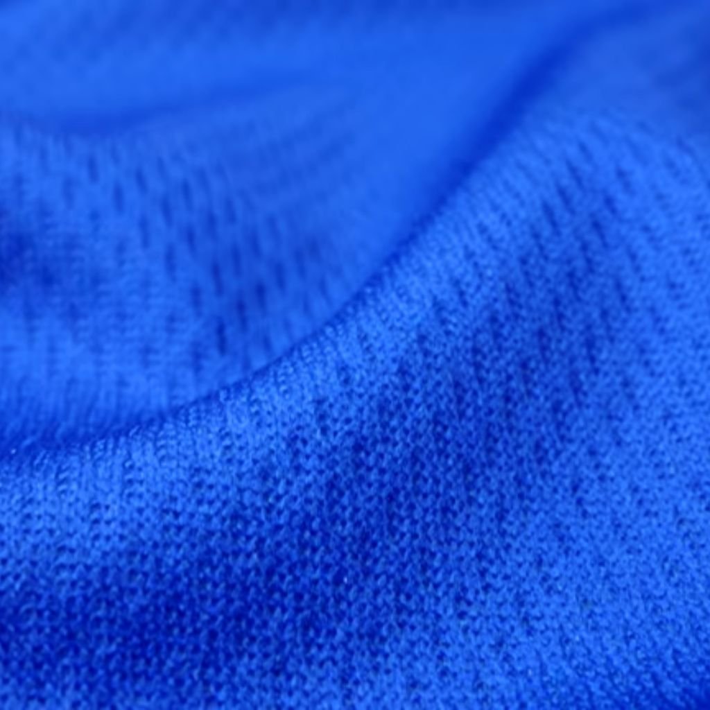 Rapid Dry Sports Knit: Train Hard, Stay Dry, Perform Better 9 Light blue waffle-weave fabric with raised square texture, visible air channels, and soft matte finish — engineered for insulation and moisture management. Rapid Dry Sports Knit: