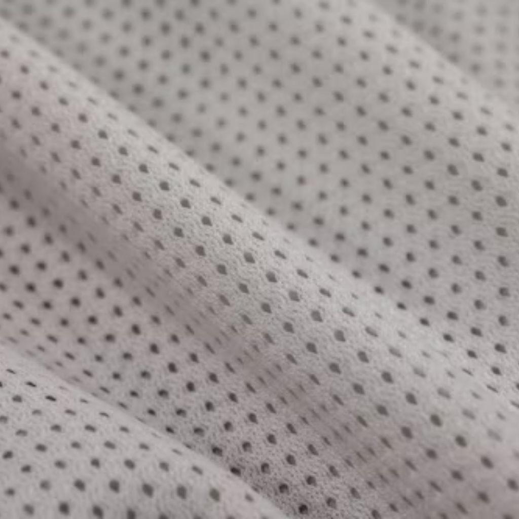 Polar Air Breathable Fabric:White technical fabric with evenly spaced micro-perforations, showing natural folds and matte surface texture for breathability and abrasion resistance.

