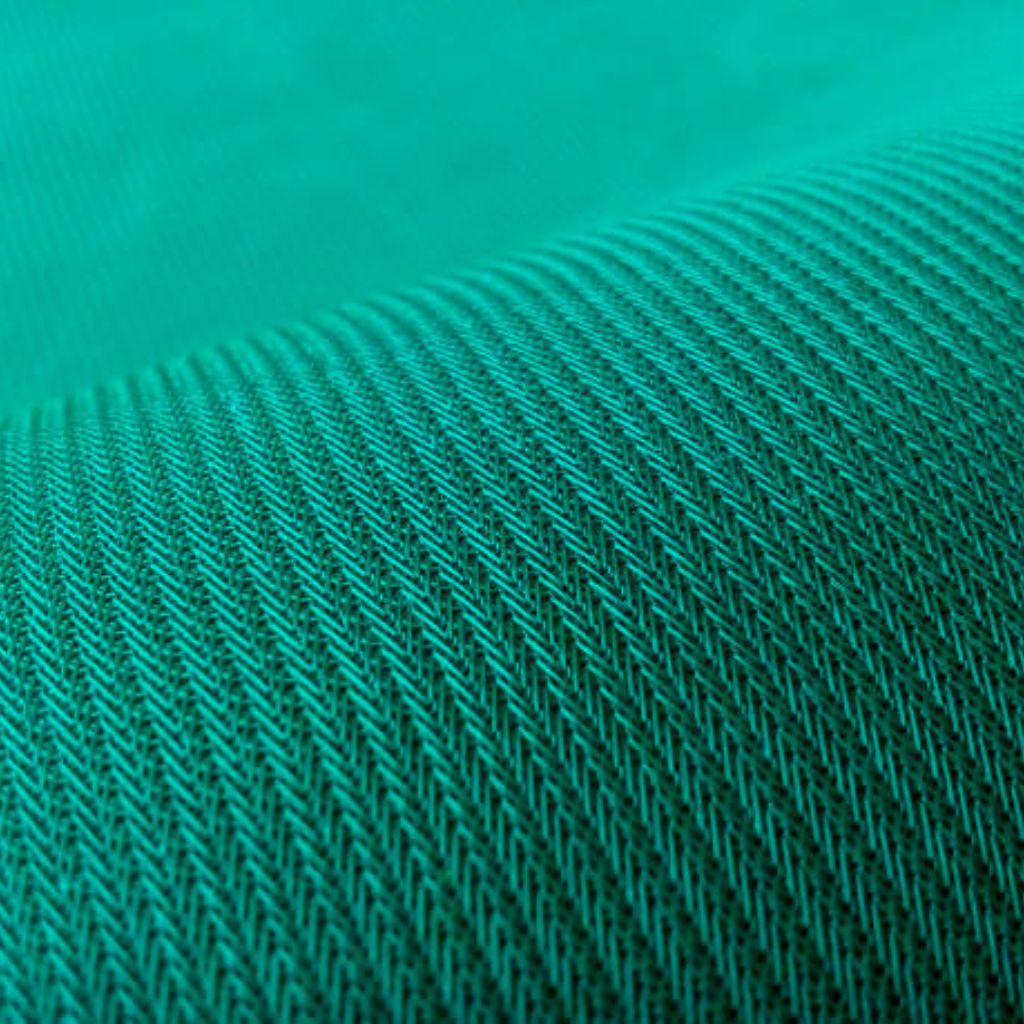 Turquoise diagonal-weave wool-acrylic blend fabric with pronounced texture, soft drape, and directional light revealing subtle tonal gradation.
Aqua Wick Performance Textile: