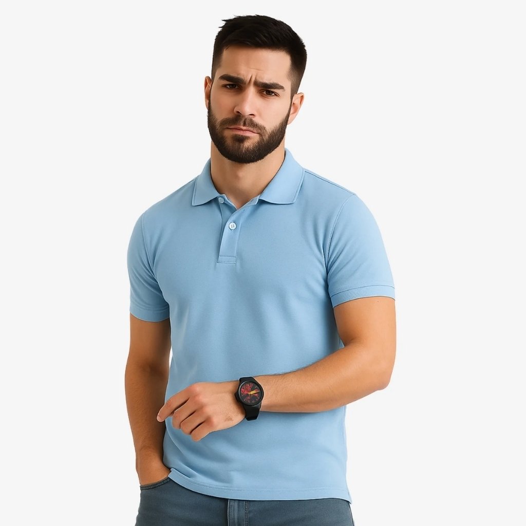 Man wearing a light blue polo T-shirt with a watch, posed against a plain background.

