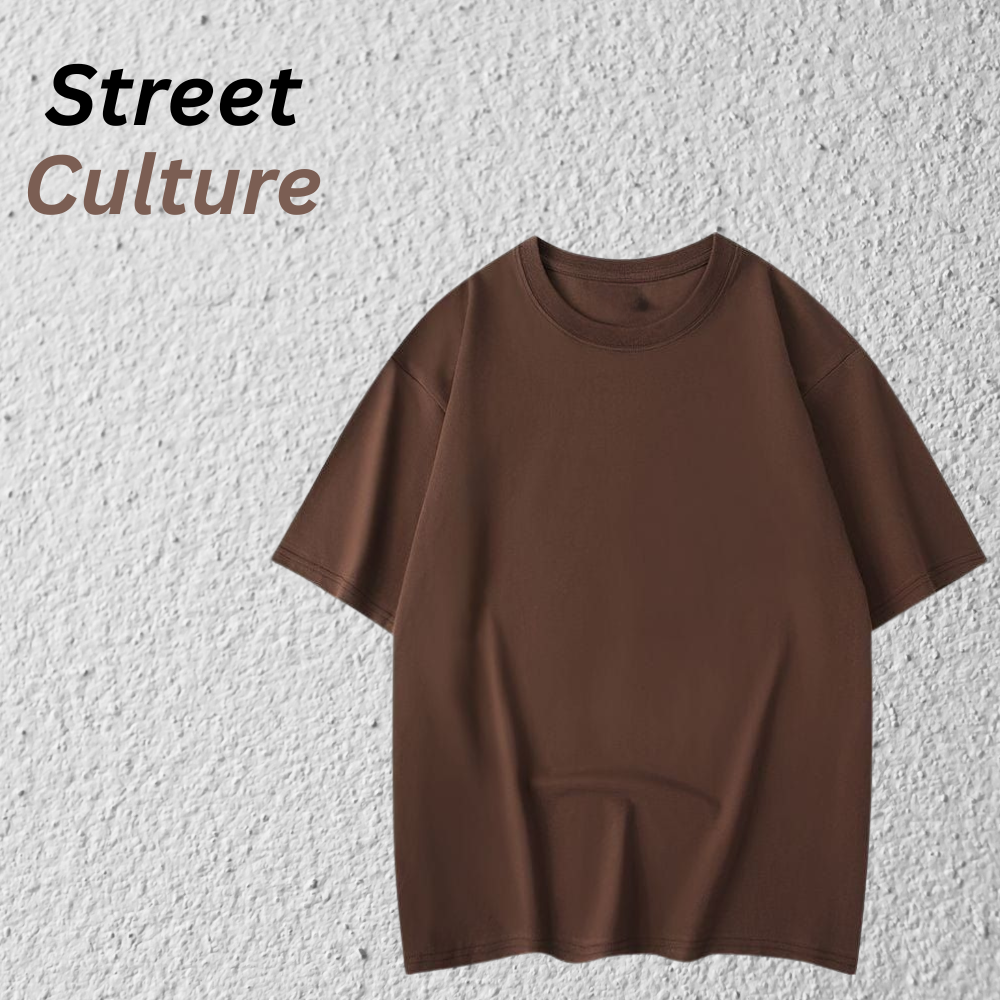 Modern Drop Shoulder Tee – Minimal Streetwear Look 12 Minimal streetwear drop-shoulder t-shirt in a solid brown color, shown flat on a textured light background.