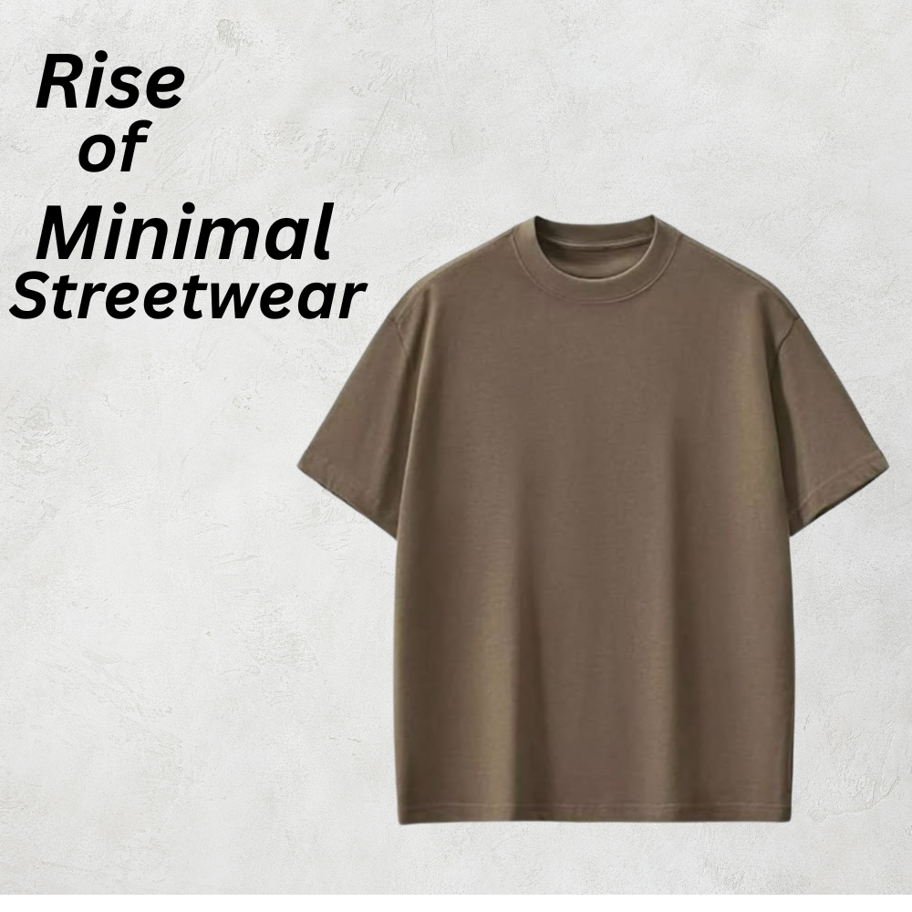Modern Drop Shoulder Tee – Minimal Streetwear Look 9 Minimal streetwear modern drop-shoulder tee in a muted taupe/brown color, featuring a relaxed fit against a light textured background.