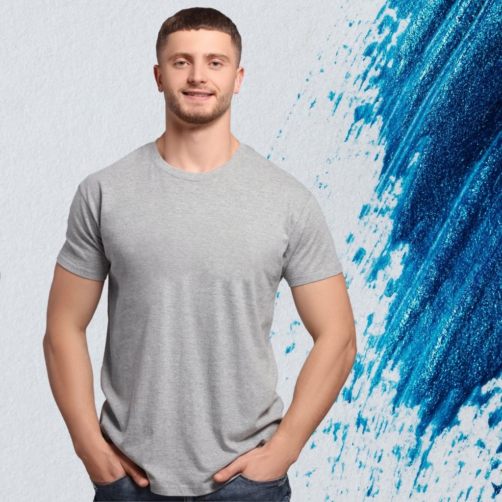 Slim fit T-shirt model wearing a heather gray crew-neck slim fit tee with a blue abstract paint-splash background.

