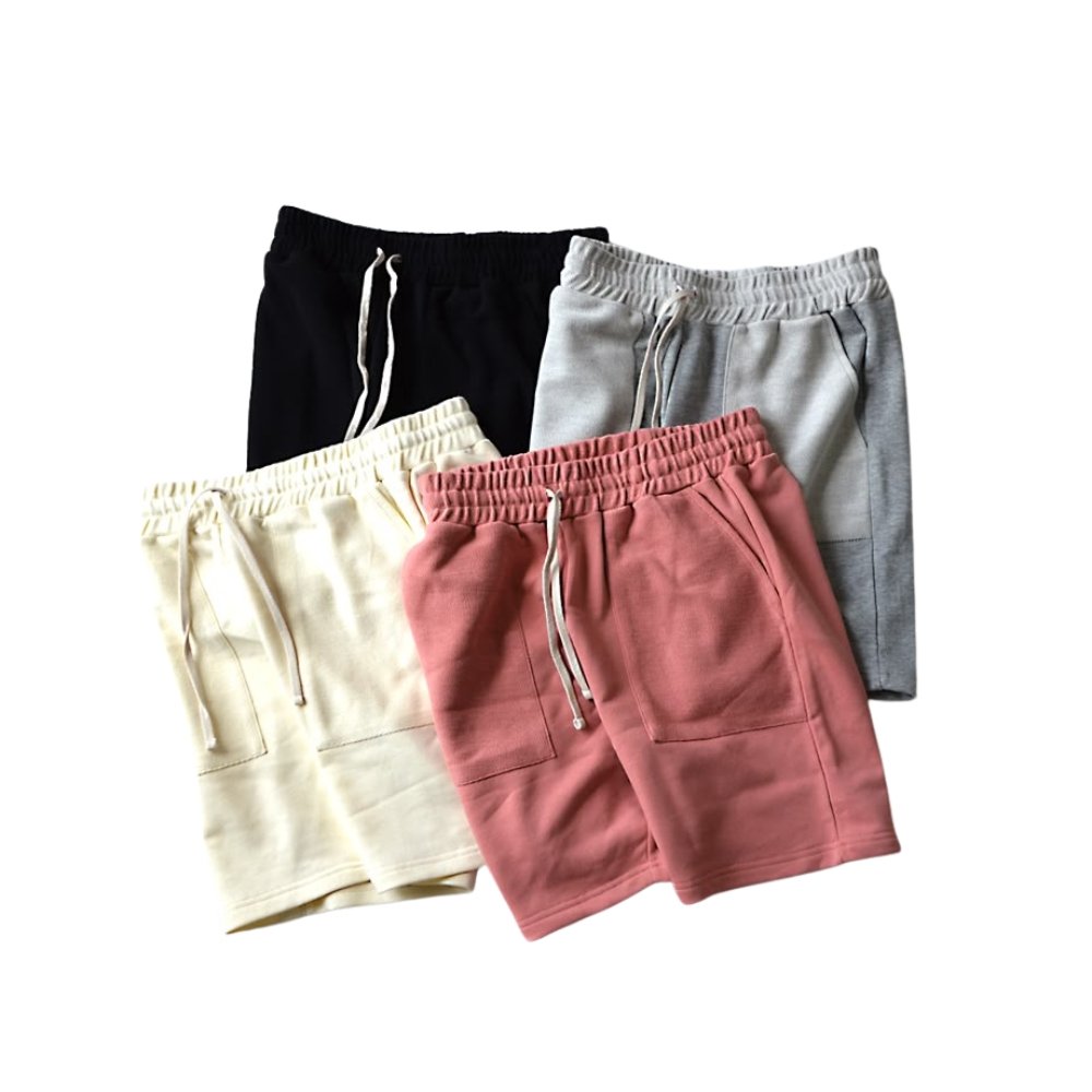 Casual Beachwear Essentials: Stylish Swim Shorts 15 Set of men’s swimwear shorts in black, light gray, cream, and dusty pink with elastic waistband, drawstring, and side pockets.