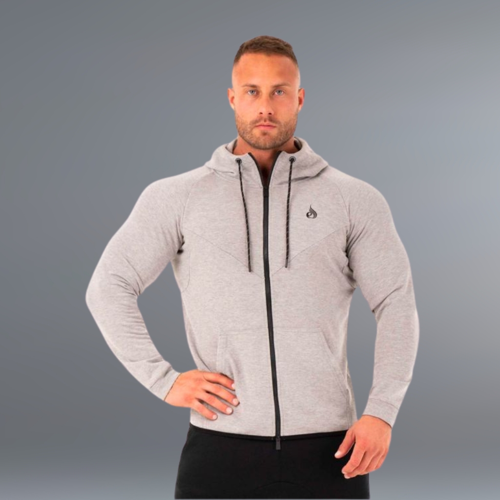 Slim fit zip-up gym hoodie in light gray on a clean background, featuring a hood with drawstrings and a full-zip front.