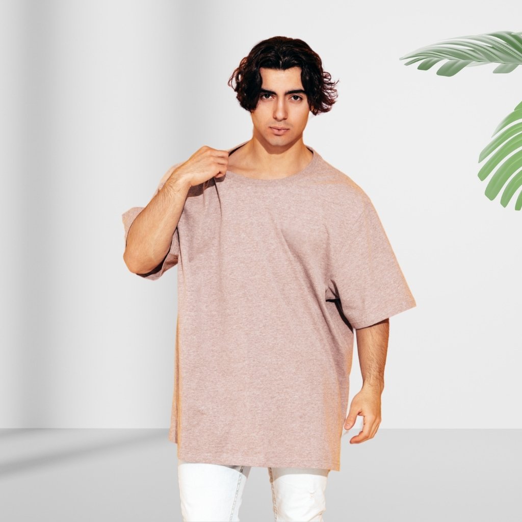 Oversized T-Shirts for Men: Streetwear Style, Relaxed Fit 4 Model wearing an oversized beige T-shirt styled in streetwear against a clean studio background.