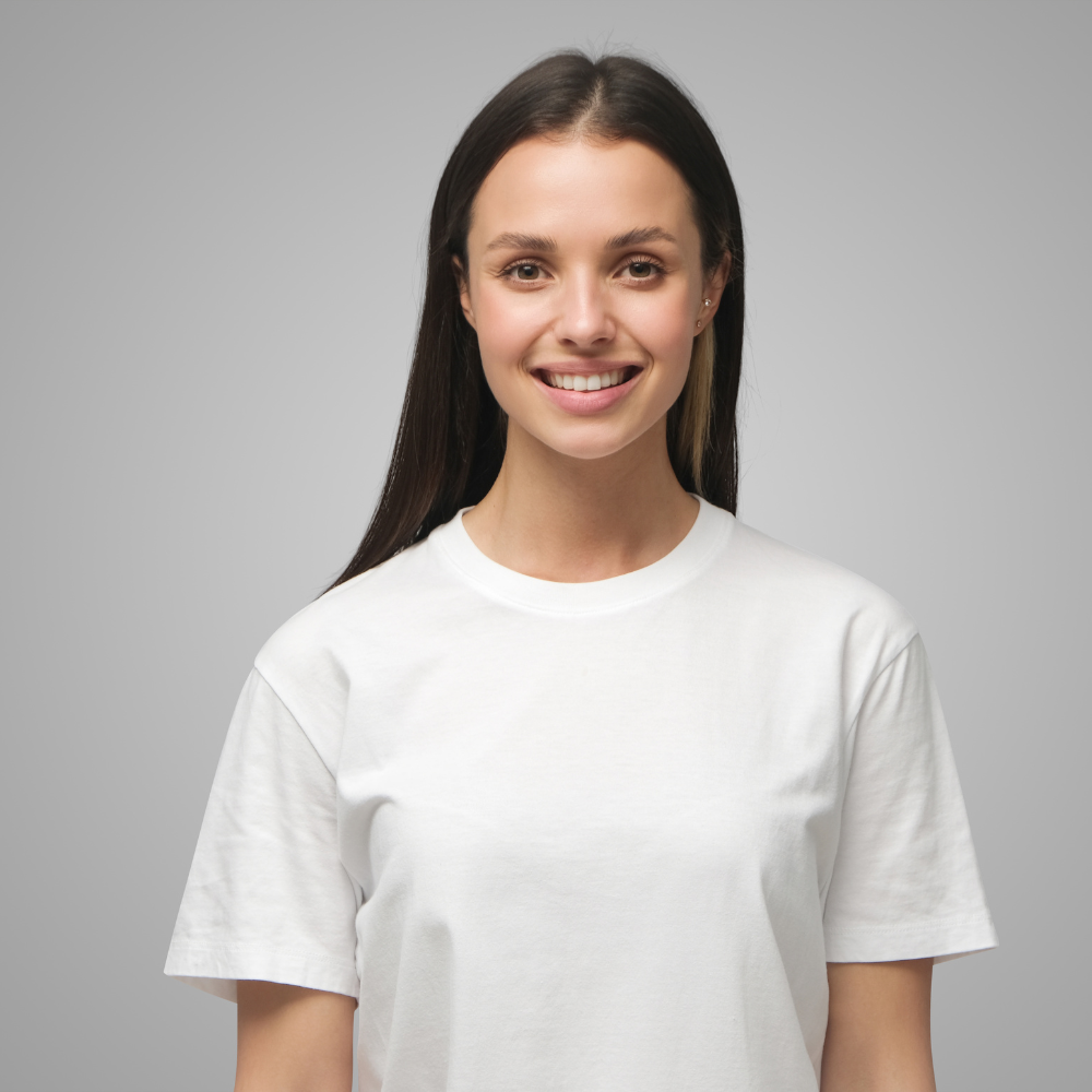 Portrait of a woman wearing a plain white crew-neck T-shirt against a plain gray background.