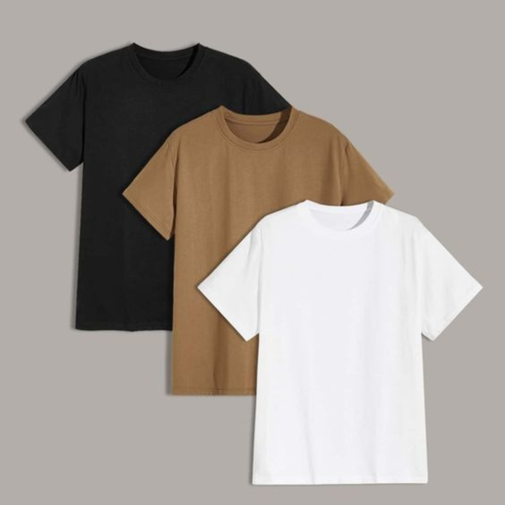 Three plain crew-neck T-shirts in black, tan, and white laid out side by side against a solid gray background
