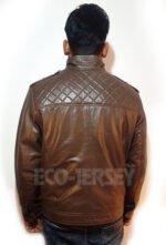 Back view of a man wearing a black leather motorbike jacket with quilted shoulder detailing.