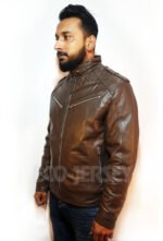 Man in a leather biker jacket looking confidently to the left, showing off the quilted collar and shoulder details.