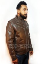 Man wearing a leather motorbike jacket facing right, highlighting front zip pockets and tailored fit.
