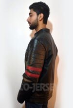 Alternate side profile of a man wearing a black leather jacket with red accents.