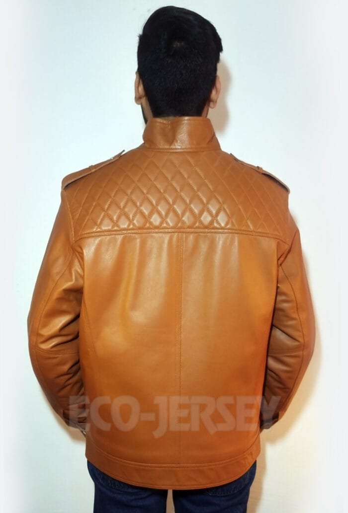 The back of a brown leather jacket features a quilted shoulder design and shoulder epaulets.
