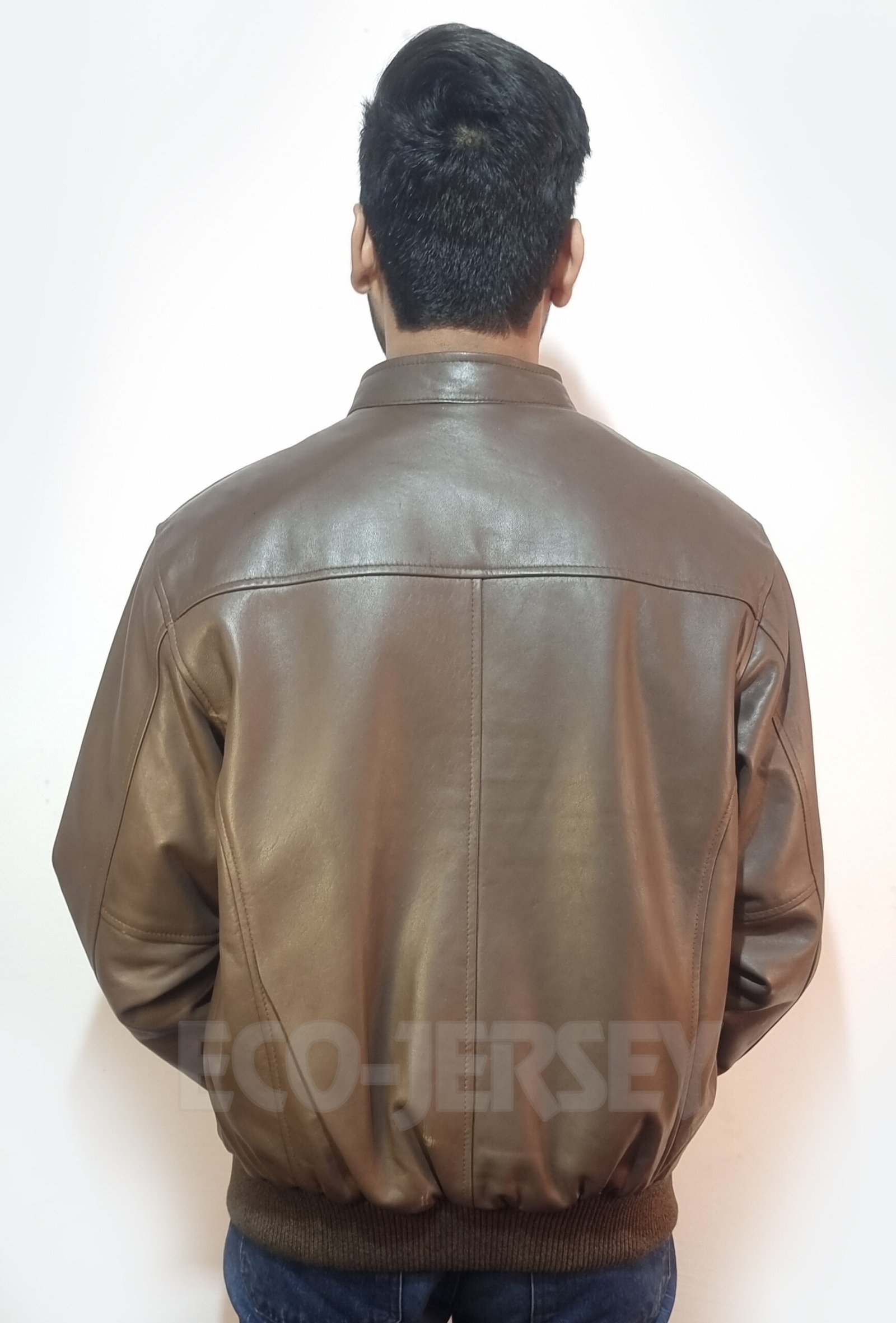 Back view of a premium sepia brown leather bomber jacket for men with clean tailoring and sustainable materials