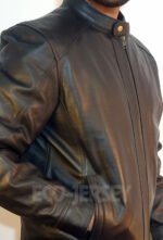 Man in black leather jacket with hands in pockets
