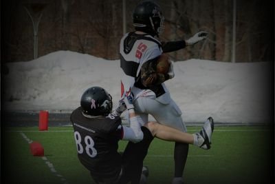 Gugby passion and aggration in the ground by two players.