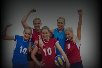 A team of volleball expressing their happyness by wearing sportswear volleyball uniforms.