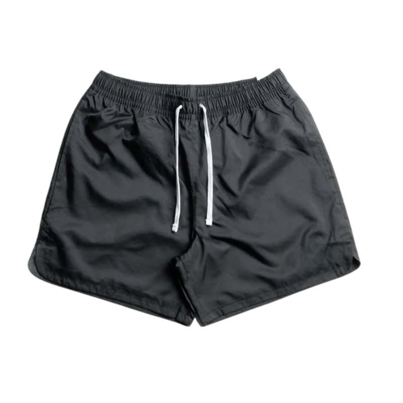 "Black badminton shorts with an elastic waistband and white drawstring.