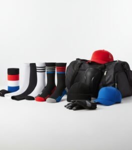 Basketball accessories including athletic socks, sports caps, gym bag, gloves, knee support, and beanie arranged on a clean studio background.
