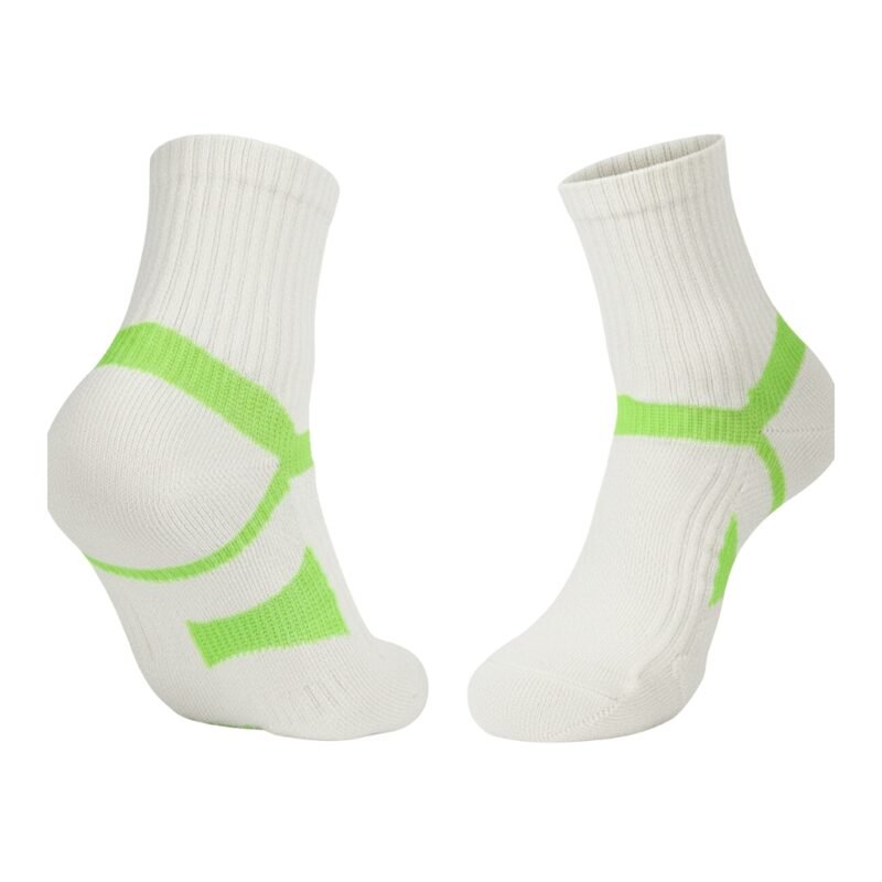 White badminton socks with green trim and a swoosh star pattern.