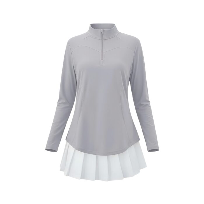 Light gray long-sleeve golf top with a mock neck and partial zipper, paired with a short white pleated skirt.