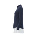 Side view of a navy long-sleeve golf top with a white pleated skirt.