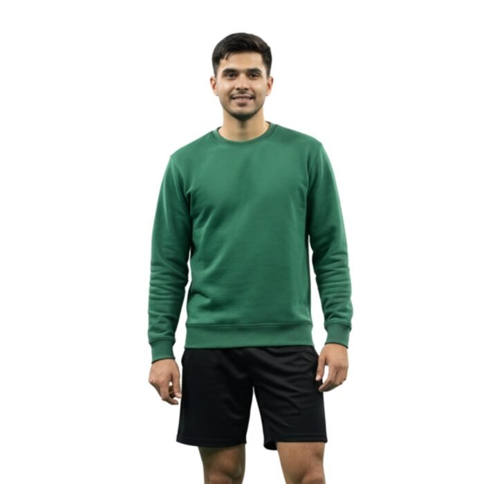 Man wearing a green long-sleeve badminton sweatshirt and black athletic shorts on a white background.