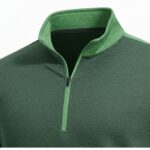 Close-up of a green heathered golf quarter-zip pullover showing the light-green collar and partially open zipper, against a white background.