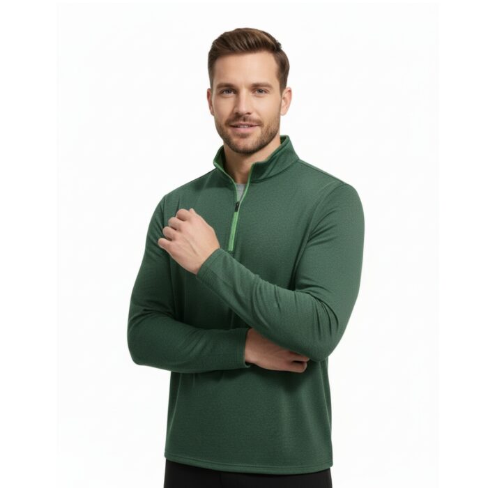 Man with short brown hair wearing a dark green textured long-sleeve golf pullover with a bright green zipper and collar trim, standing with arms crossed against a white background.