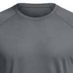Close-up of a gray short-sleeve athletic shirt with a crew neck and raglan sleeves; small three-dimensional logo on the chest and a textured fabric