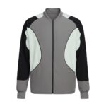 Front view of a long-sleeved gray bomber jacket with black and light teal geometric accents, zippered front and ribbed cuffs.
