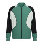 Front view of a color-block tennis jacket with green body, white curved panels, and black sleeves; zip-front with ribbed collar and cuffs.