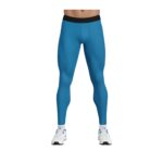 Front view of a person wearing blue men's compression tights with a black waistband and a side pocket, paired with white athletic shoes with blue accents, shown against a white background.