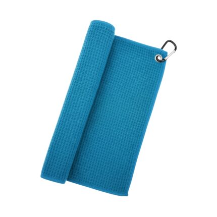A light blue waffle-textured golf towel folded with a roll on the left and a silver carabiner on the top-right corner.