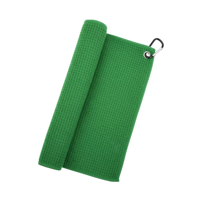 A bright green waffle-textured golf towel partially rolled on the left with a silver grommet and black carabiner on the top-right corner.