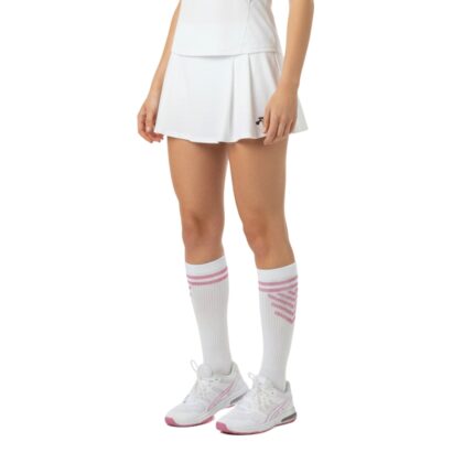 Woman in white tennis outfit with matching white socks featuring light pink stripes; full-body view on white background