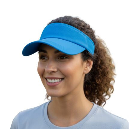 Smiling woman wearing a light blue golf visor with a light blue shirt against a white background