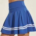 Blue women’s badminton skort with pleated skirt design and white stripe trim.