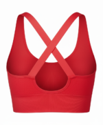 Back view of a red women's sports bra with a wide bottom band and cross-back straps, shown against a white background.