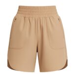 Beige women's athletic tennis shorts with an elastic waistband, front pockets, and curved hems. Some versions feature zippered side pockets; the shorts are displayed against a white background.