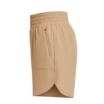 Side view of khaki women's tennis shorts with an elastic waistband, a vertical zipper pocket on the left, rounded layered hem, and a plain white background