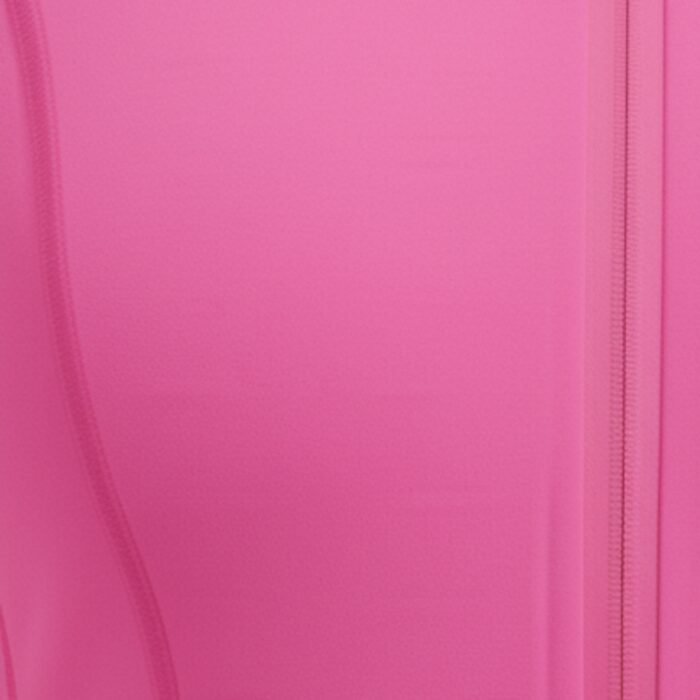 Woman wearing a hot pink badminton jacket with a high stand collar and long sleeves.