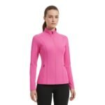 Woman wearing a bright pink badminton jacket with a full-length zipper and stand collar.