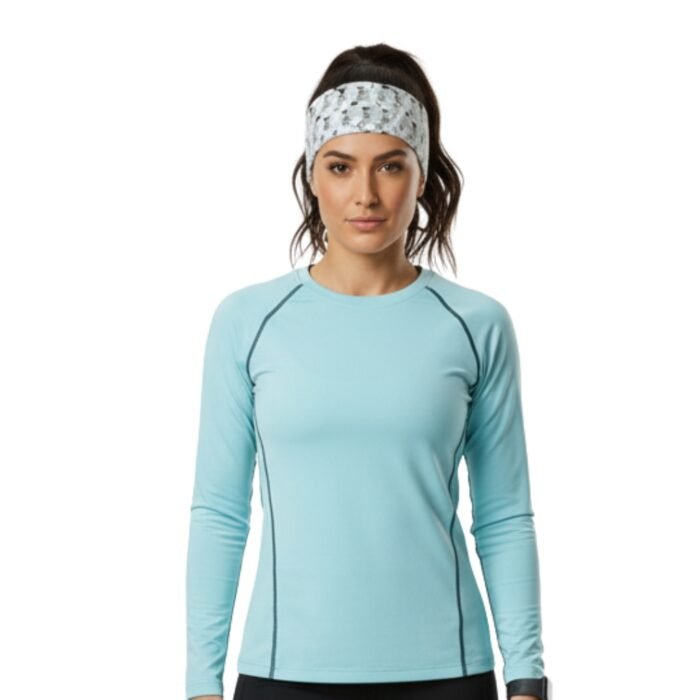 A person wearing a gray patterned headband paired with a light blue long-sleeve athletic shirt.