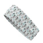 A headband with a geometric pattern in shades of gray, white, and light blue.