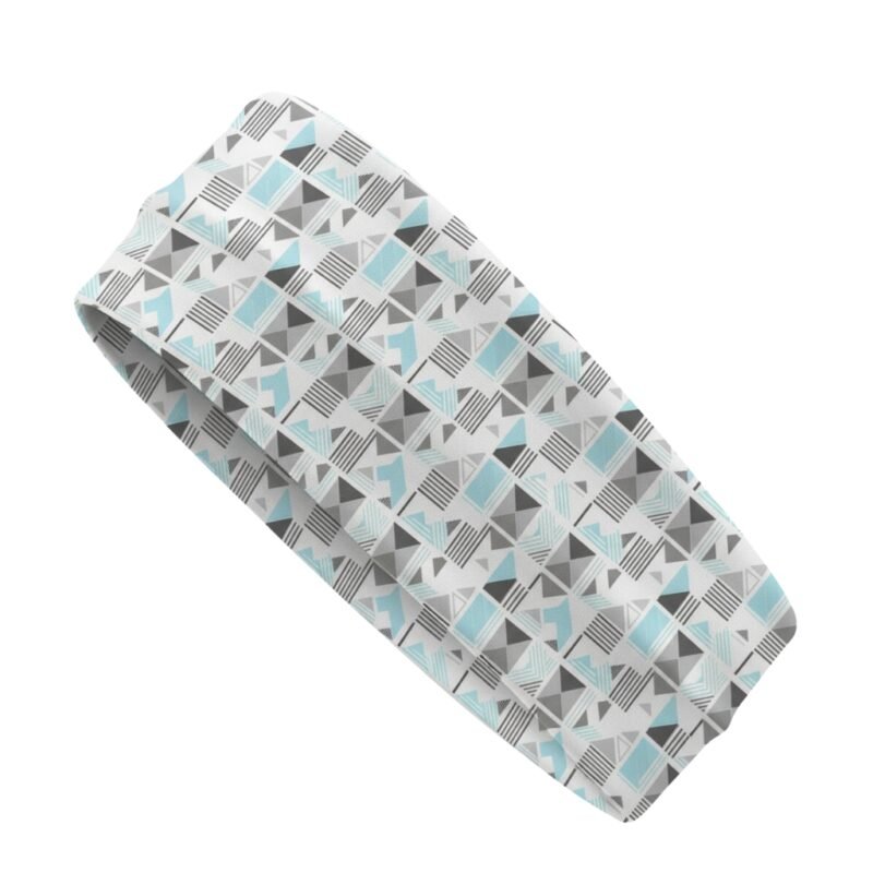 A headband with a geometric pattern in shades of gray, white, and light blue.