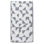 Geometric textile swatch with a navy-and-white patchwork pattern of triangles and squares.