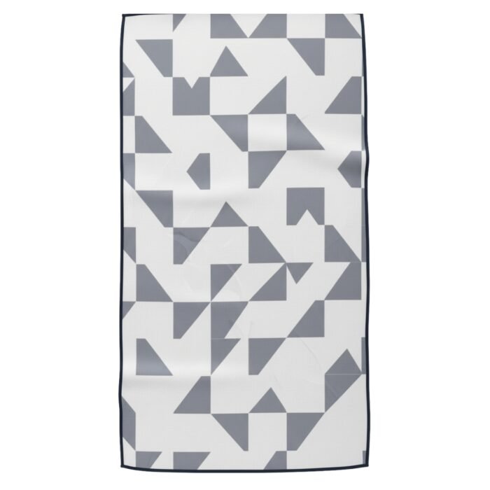 Geometric textile swatch with a navy-and-white patchwork pattern of triangles and squares.